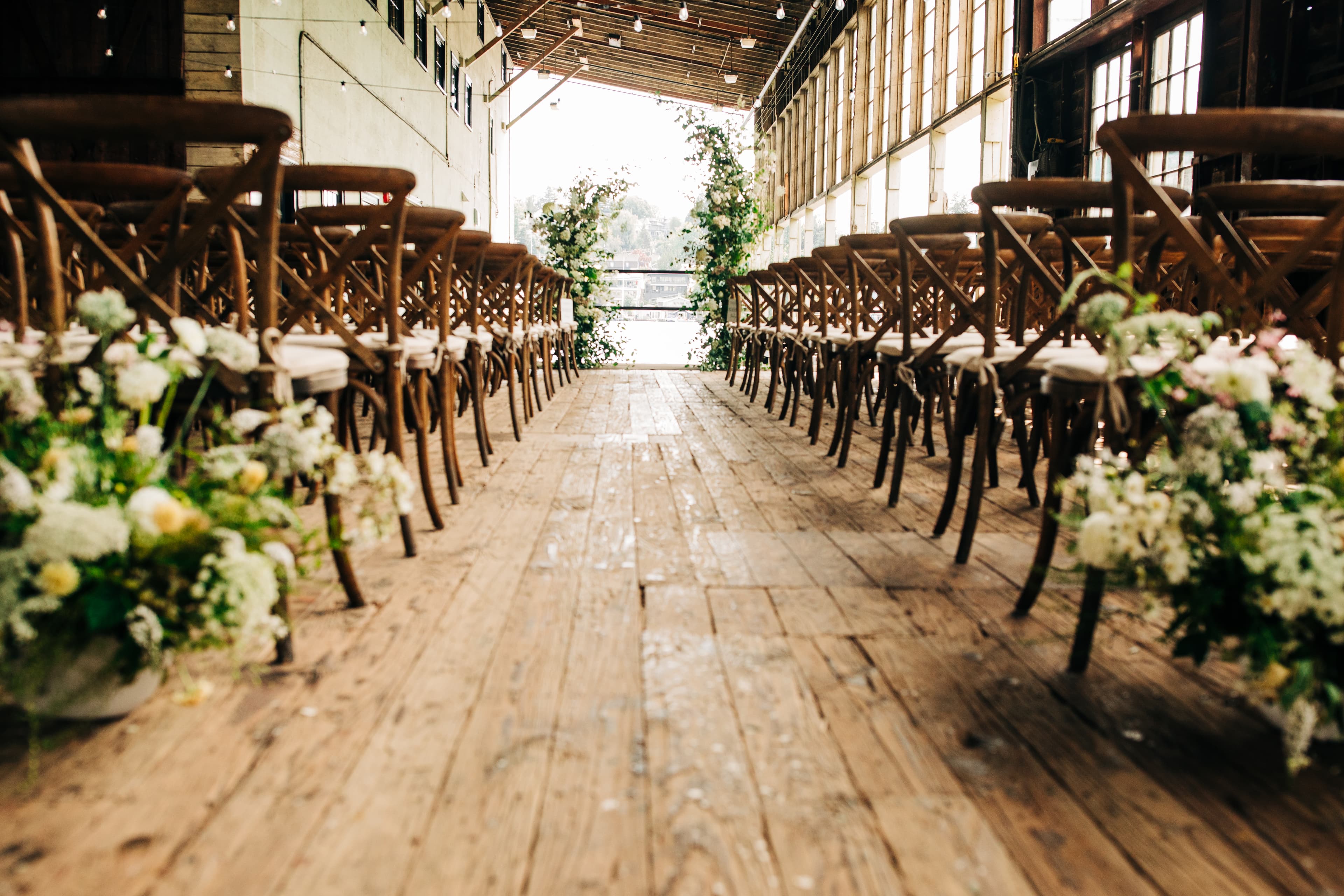Wedding ceremony in front of guests overlooking Portage Bay